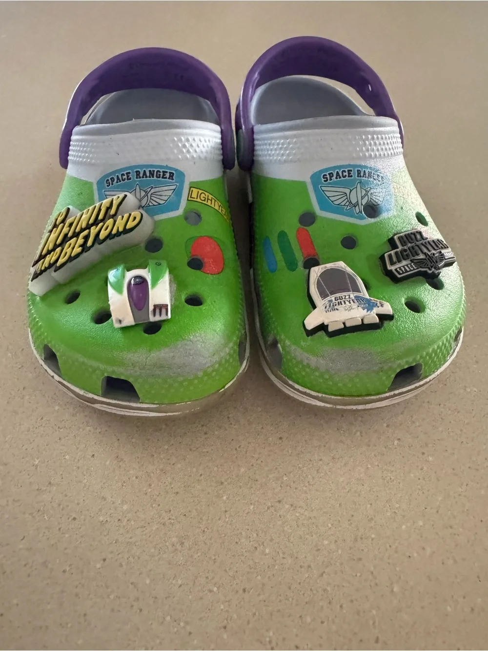 CROCS Kids Green Clogs with Purple Heel Strap and Space Charms
